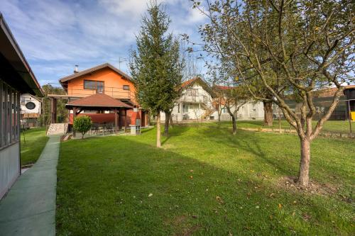 a yard with a house and trees in front of it at House Pepica With Hot Tub - Happy Rentals in Kraljevec na Sutli
