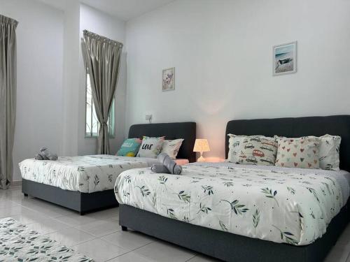 Voodi või voodid majutusasutuse Cendana House@Juru/Autocity/Bkt Minyak/Batu Kwan/IKEA toas