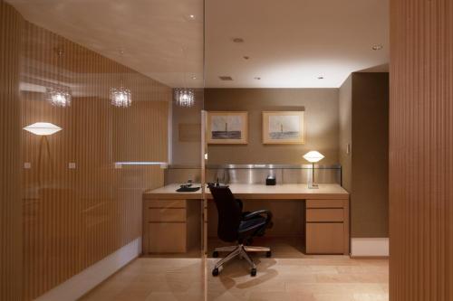 an office with a desk and a chair in a room at Sapporo Grand Hotel in Sapporo