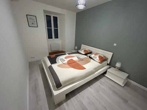 a bedroom with a large bed in a room at Havre de tranquillité à 13Kms des plages de Royan in Le Gua
