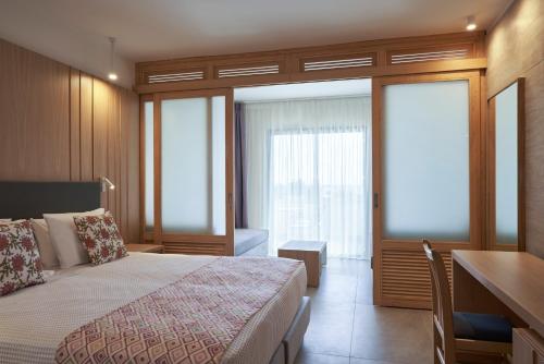 Postel nebo postele na pokoji v ubytování Atlantica Mikri Poli Rhodes