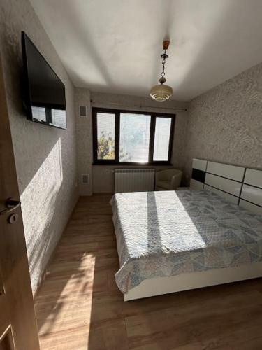 Ένα ή περισσότερα κρεβάτια σε δωμάτιο στο Luxurious flat Pleven Center