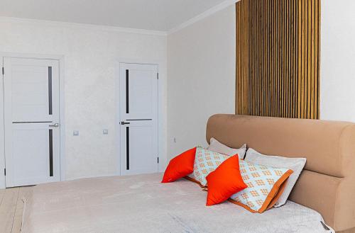 Postel nebo postele na pokoji v ubytování YourHouse ЖК Nest Grand