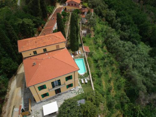 an aerial view of a house with an orange roof at Massarosa Front Lake, The Gargoyles in Massarosa