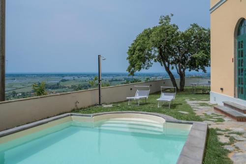 a swimming pool on the roof of a building at Massarosa Front Lake, The Gargoyles in Massarosa