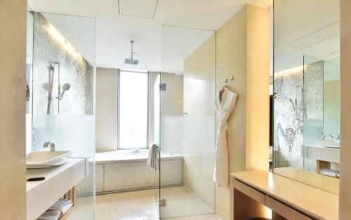 a bathroom with a shower and a sink at The Westin Gurgaon, New Delhi in Gurgaon