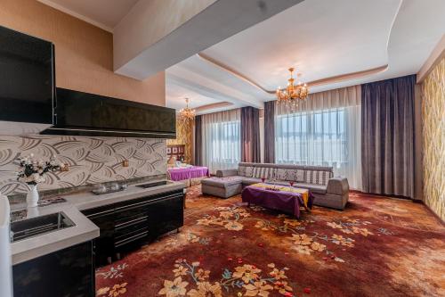a large living room with a couch and a table at Amar Hotel Complex in Ulaanbaatar