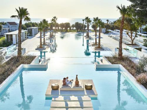 a rendering of the pool at the resort at Grecotel Lux Me Dama Dama in Faliraki