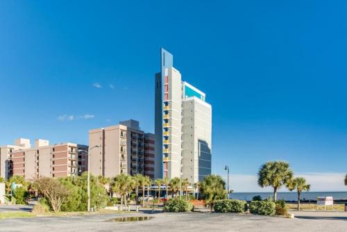 a tall building in front of a city at Ocean View 1BR Condo with Private Balcony in Myrtle Beach