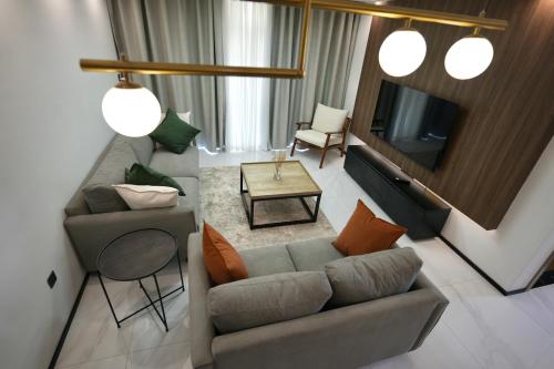 an overhead view of a living room with a couch and a tv at An Oasis in the heart of Kigali in Kigali
