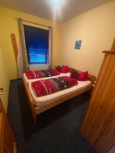 Postel nebo postele na pokoji v ubytování Gablenzer Freizeit, Ferienwohnung Noack Wohnung für 4 Personen