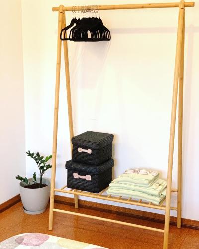 a room with a bunk bed with two trunks at Apartamento Fonte Velha in Nazaré