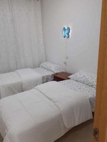 Кровать или кровати в номере Talavera Apartament