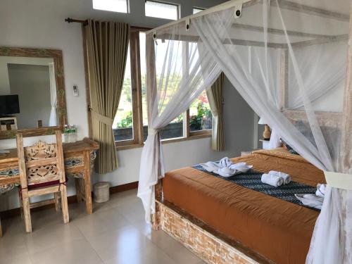 Ένα ή περισσότερα κρεβάτια σε δωμάτιο στο Raditya Villa Ubud