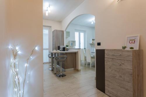 a living room with a kitchen and a dining room at Modern House Santa Rita by Wonderful Italy in Turin