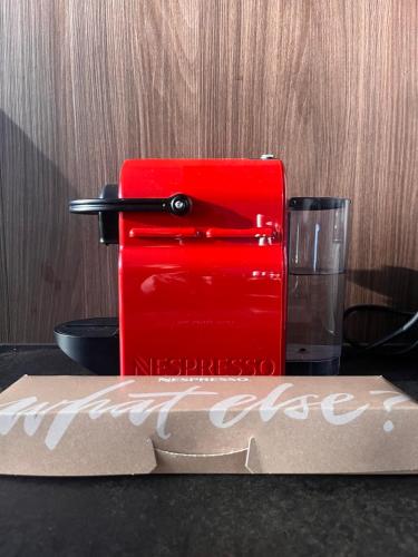 a red box sitting on a table with a glass at Villa Isabell in Kõrve Üks
