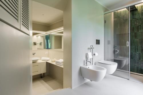 a bathroom with a toilet and a sink at Parco dei Principi in Sorrento