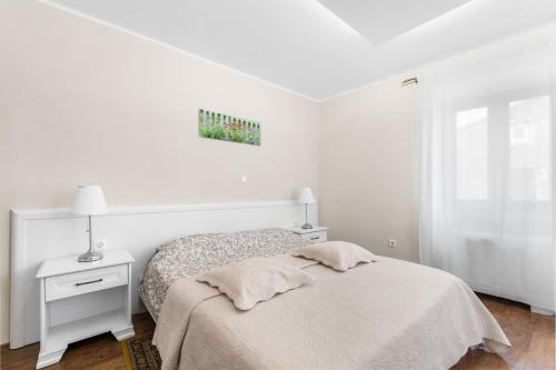 Ένα ή περισσότερα κρεβάτια σε δωμάτιο στο Vila Flavia