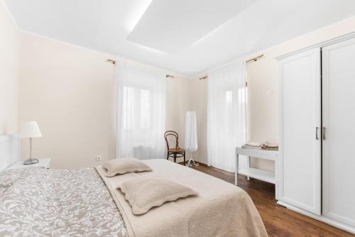 Ένα ή περισσότερα κρεβάτια σε δωμάτιο στο Vila Flavia