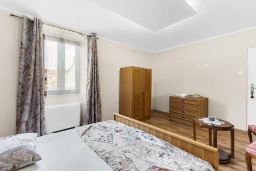 Ένα ή περισσότερα κρεβάτια σε δωμάτιο στο Vila Flavia