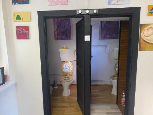 a bathroom with a toilet in a room at local tax 3 Eur guest for night in Semmering