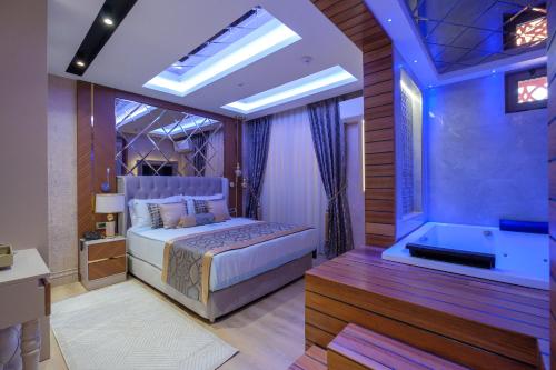 Ένα ή περισσότερα κρεβάτια σε δωμάτιο στο Elysium Deluxe Suites Antalya