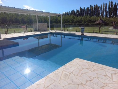 a large swimming pool with a tiled floor at Rio los Patos in Barreal