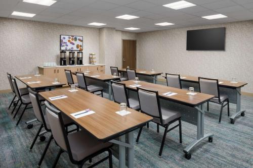 a conference room with tables and chairs and a tv at Hyatt Place Orlando / I-Drive / Convention Center in Orlando