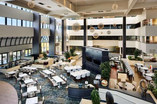 an image of the lobby of a hotel at Embassy Suites by Hilton West Palm Beach Central in West Palm Beach