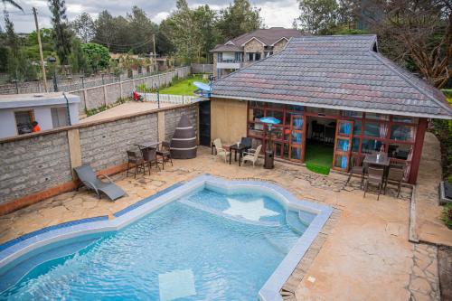 an overhead view of a swimming pool in a backyard at The Blixen Resort & Spa in Nairobi