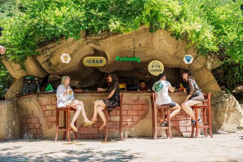 a group of people sitting at a bar at Anadolu Hotels Esenboga Thermal in Esenboga
