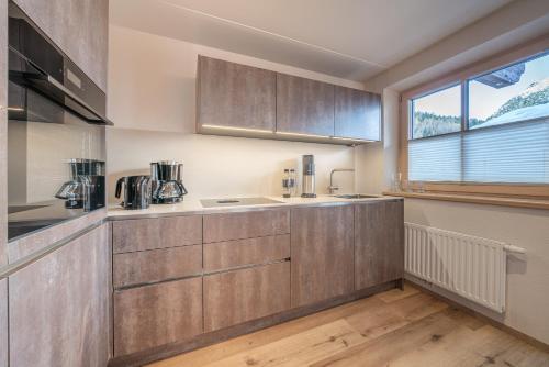 Kuchyň nebo kuchyňský kout v ubytování Weinleinshof Appartements