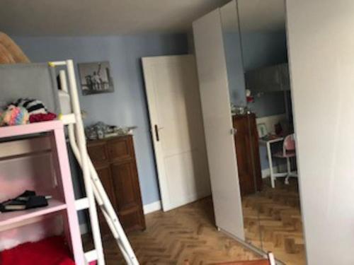 a room with a ladder and a room with a mirror at Stay in maison de metre in Etterbeek in Brussels