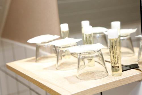 a group of glass votives sitting on top of a table at B&B Au Coq en Pate in Jalhay
