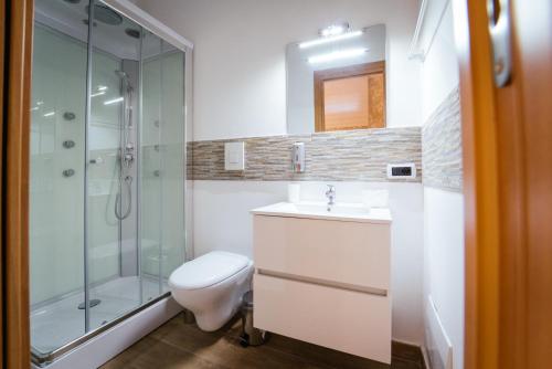 a bathroom with a toilet sink and a shower at tulipano rosso in Bari