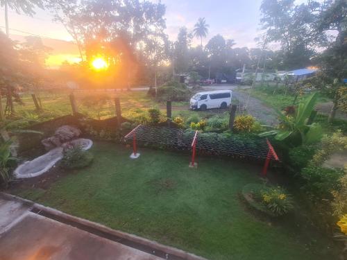 an aerial view of a yard with a white van at Rotunda Inn home stay in Pagadian