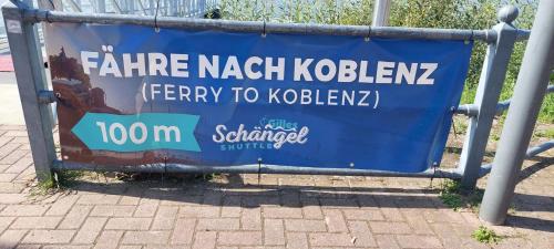 a blue sign on the side of a street at Rheingold inklusive einer Flasche Sekt in Koblenz