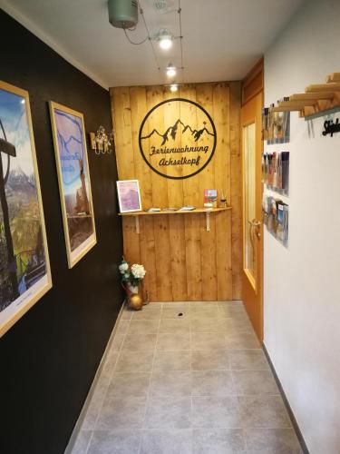 a hallway with a sign on the wall at Ferienwohnung Achselkopf in Musau