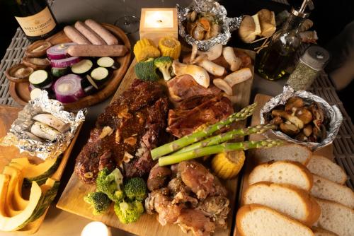a table topped with lots of different types of food at LACOSTA in Hōden