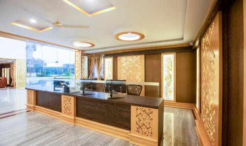 an office with a reception desk in a room at Treebo Trend Siri Ambari Resorts in Madikeri