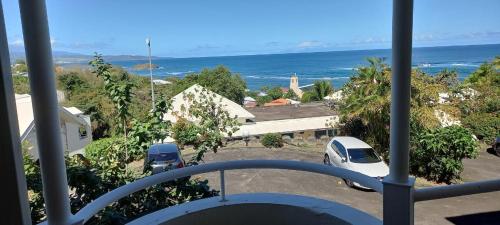 a view of the ocean from a balcony at Appartements vue mer - Résidence de la baie - Tartane in La Trinité