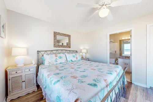a bedroom with a bed and a ceiling fan at Sunset Harbor Villas #4-421 in Navarre