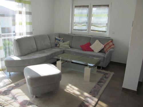 a living room with a couch and a coffee table at Ferienwohnungen Kolb in Ravensburg