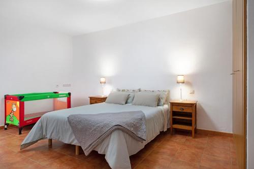 Postel nebo postele na pokoji v ubytování Casa Famara