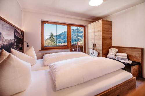 Postel nebo postele na pokoji v ubytování Hotel Alpenstüble Appartements