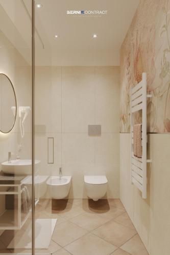 a bathroom with a toilet and a sink at Hotel Marzia in Scandicci