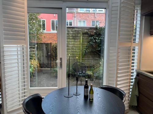 a table with two bottles of wine sitting on it at B&B Urban Oasis in Amsterdam