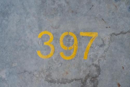 a yellow number on the floor of a street at Ipoh Tambun Sunway Onsen Suite 3R2B Maya in Tambun