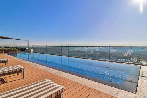 a swimming pool on top of a building at Menylyn Maine Residences Trilogy 913 in Pretoria