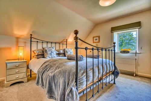 a bedroom with a bed and a window at Finest Retreats - Gag Barn in Ashbourne